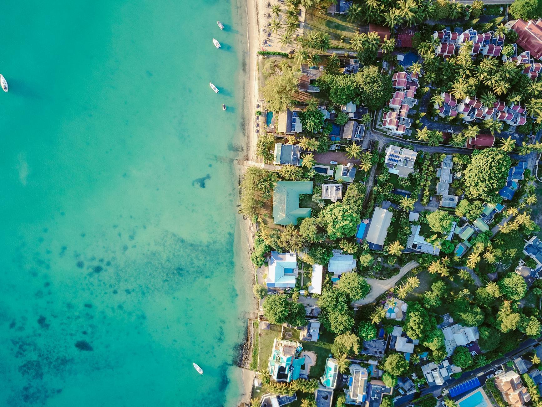 aerial photography of body of water What Makes a Market “Elite”: High-End Vacation Rental Investment Hubs