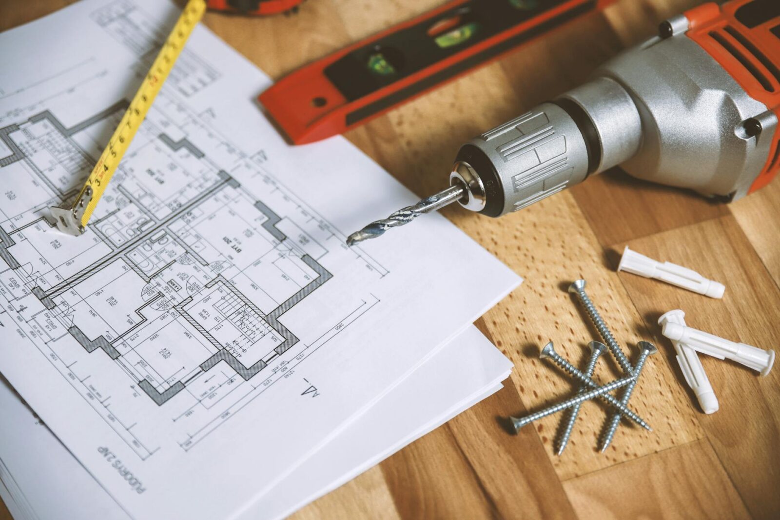 The Biggest Renovation Mistakes People Are Still Making in 2025 9 floor plan on table The Biggest Renovation Mistakes People Are Still Making in 2025