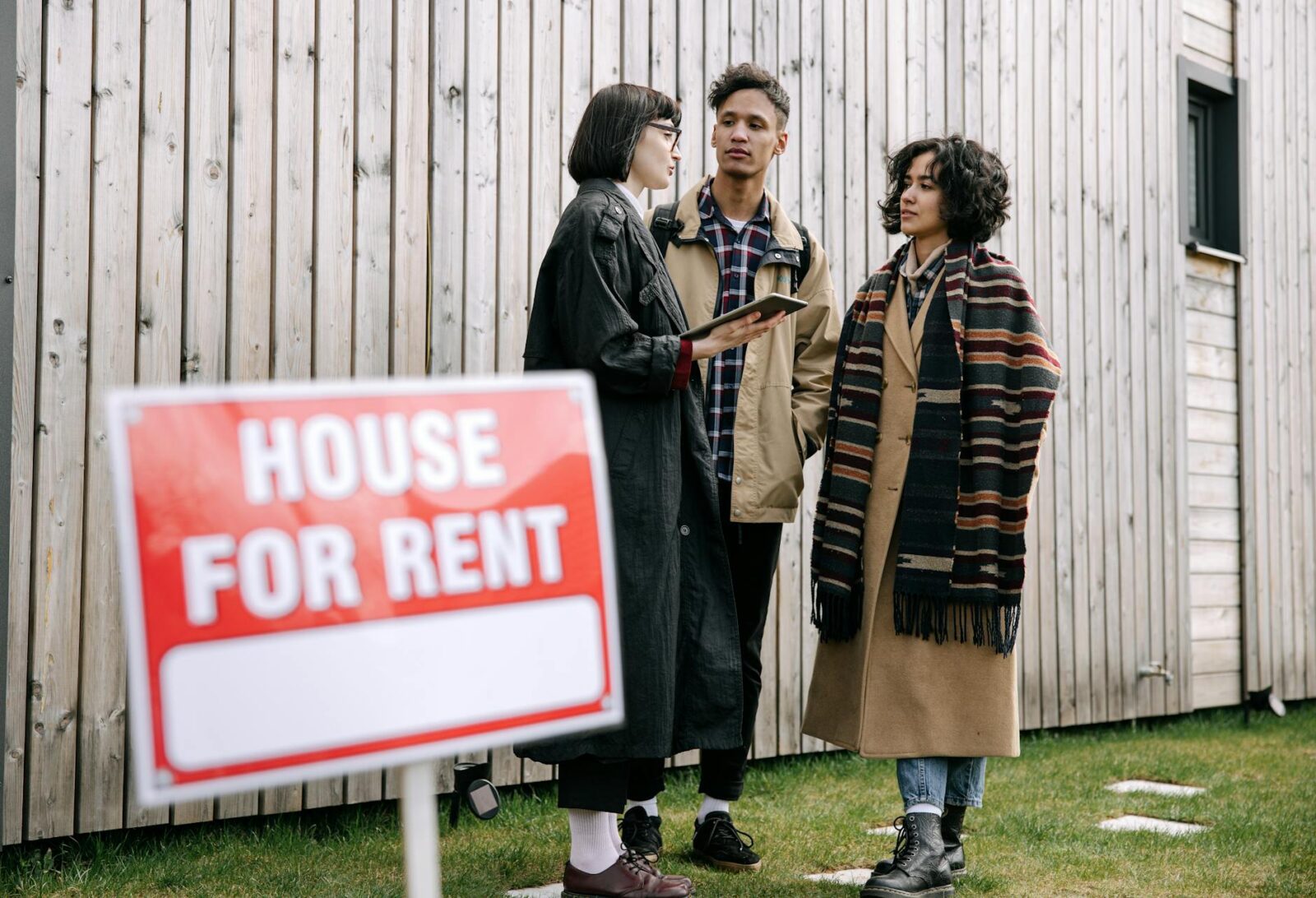 How to Handle a Landlord Dispute with Your Tenant 11 interracial couple talking to real estate agent How to Handle a Landlord Dispute with Your Tenant