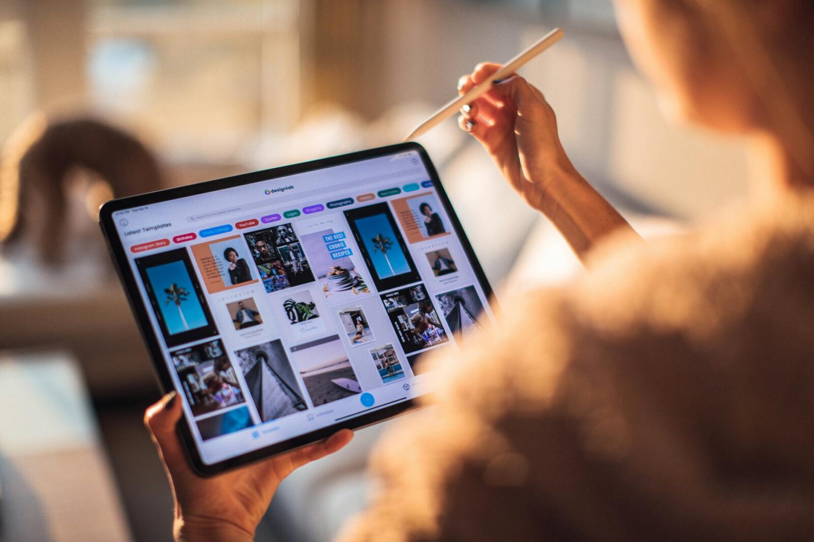 5 Top Digital Marketing Agencies Reviewed in 2025 9 woman holding tablet computer 5 Top Digital Marketing Agencies Reviewed in 2025