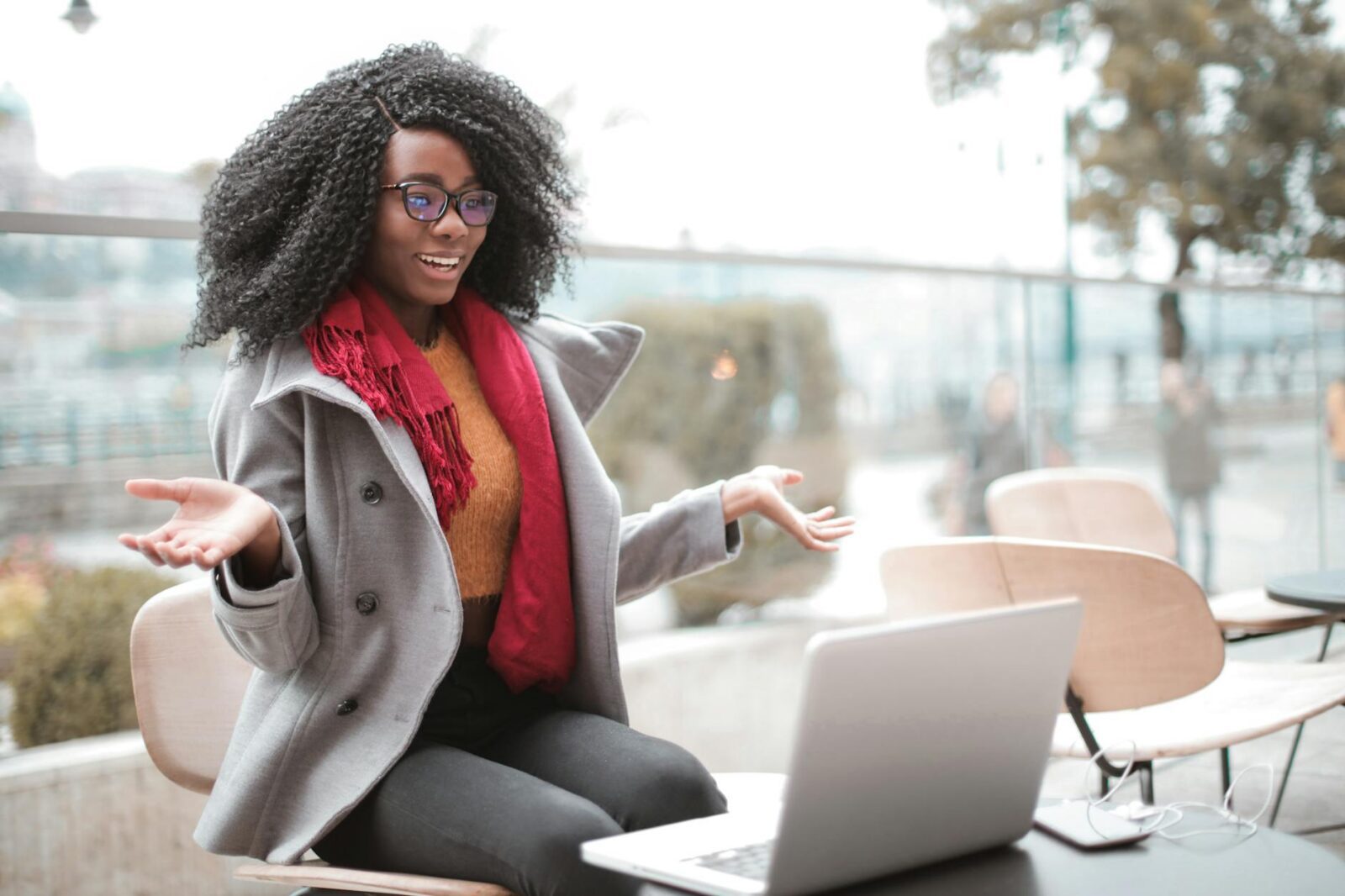 Why Virtual Meetings Are a Game-Changer for Real Estate Efficiency 8 cheerful surprised woman sitting with laptop Why Virtual Meetings Are a Game-Changer for Real Estate Efficiency