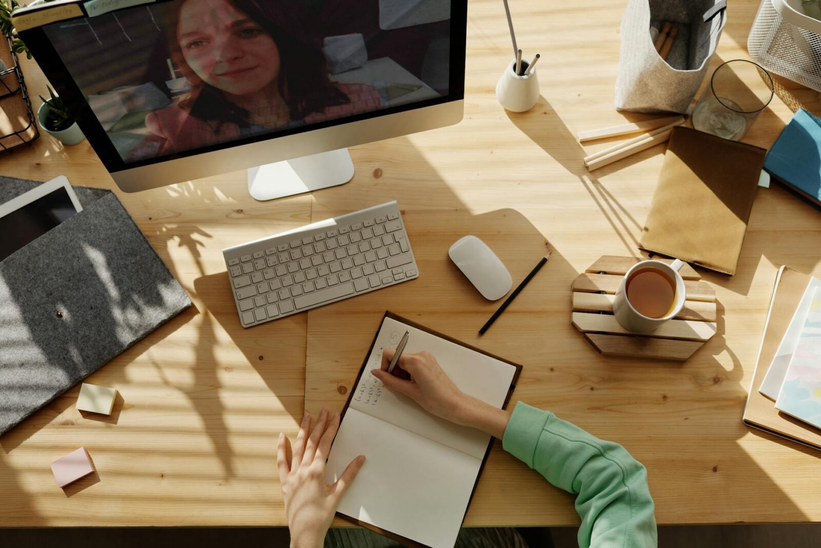 Why Virtual Meetings Are a Game-Changer for Real Estate Efficiency 7 person writing on notebook Why Virtual Meetings Are a Game-Changer for Real Estate Efficiency