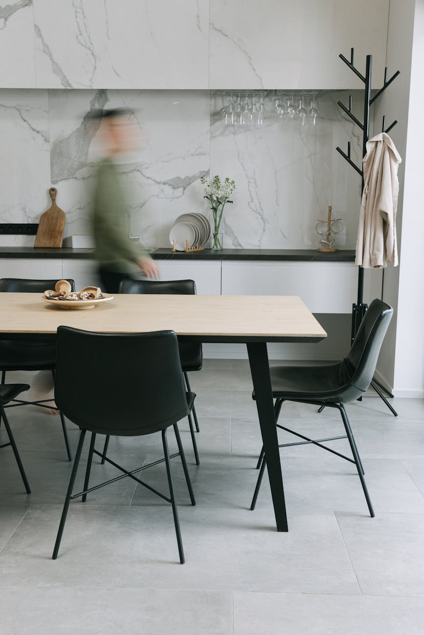 How Custom Table Bases Elevate Dining Room Aesthetics 8 brown wooden table with black chairs How Custom Table Bases Elevate Dining Room Aesthetics