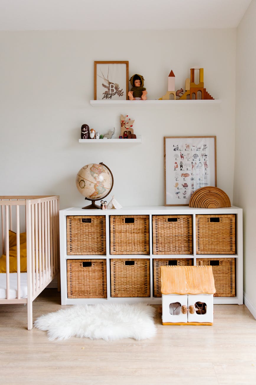 How to Create a Kid-Friendly Home Without Sacrificing Style 7 interior of children bedroom with wooden furniture and toys and globe placed on shelves in room How to Create a Kid-Friendly Home Without Sacrificing Style