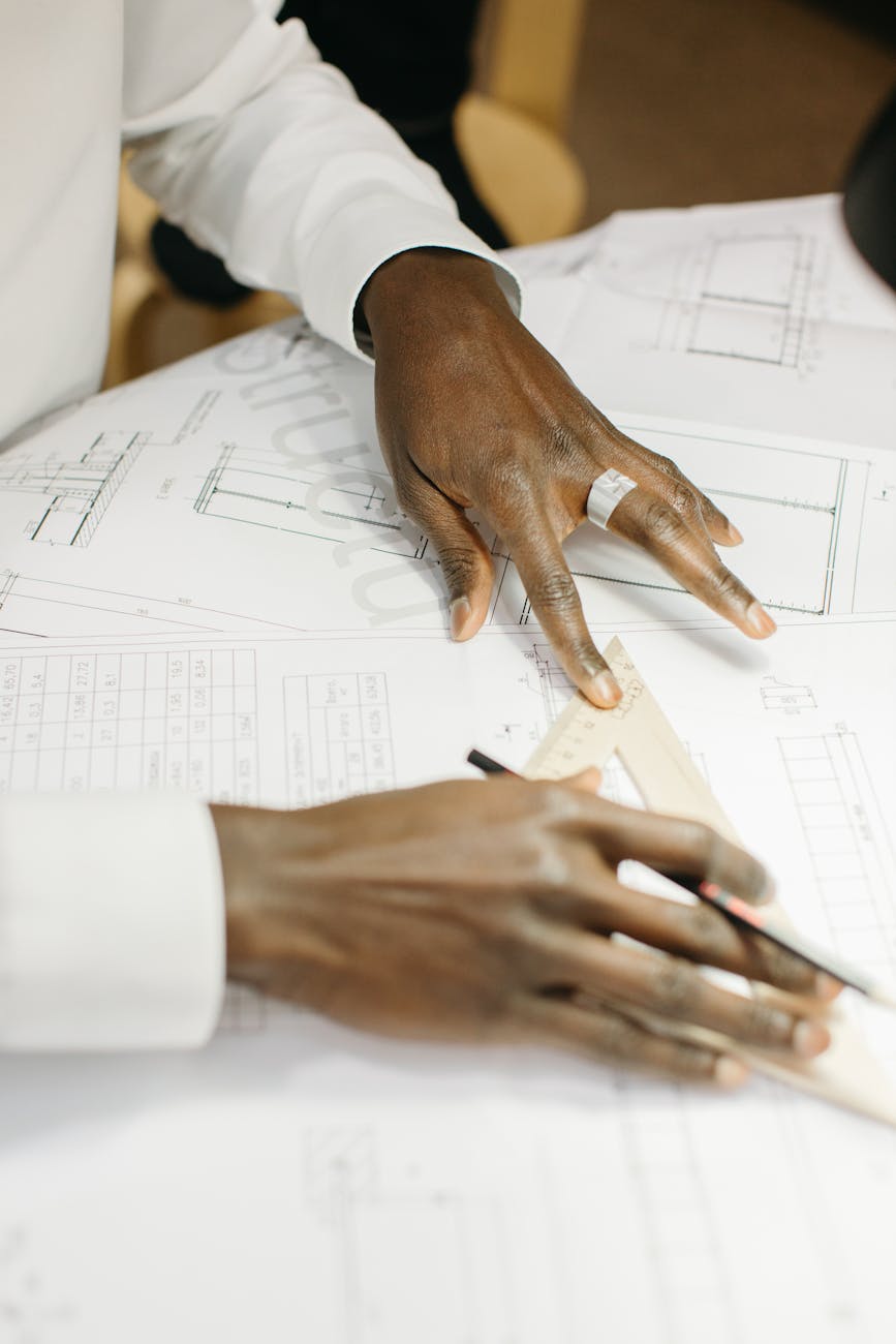How to Become a Successful Real Estate Developer: 11 Essential Steps 8 architect making a plan How to Become a Successful Real Estate Developer: 11 Essential Steps