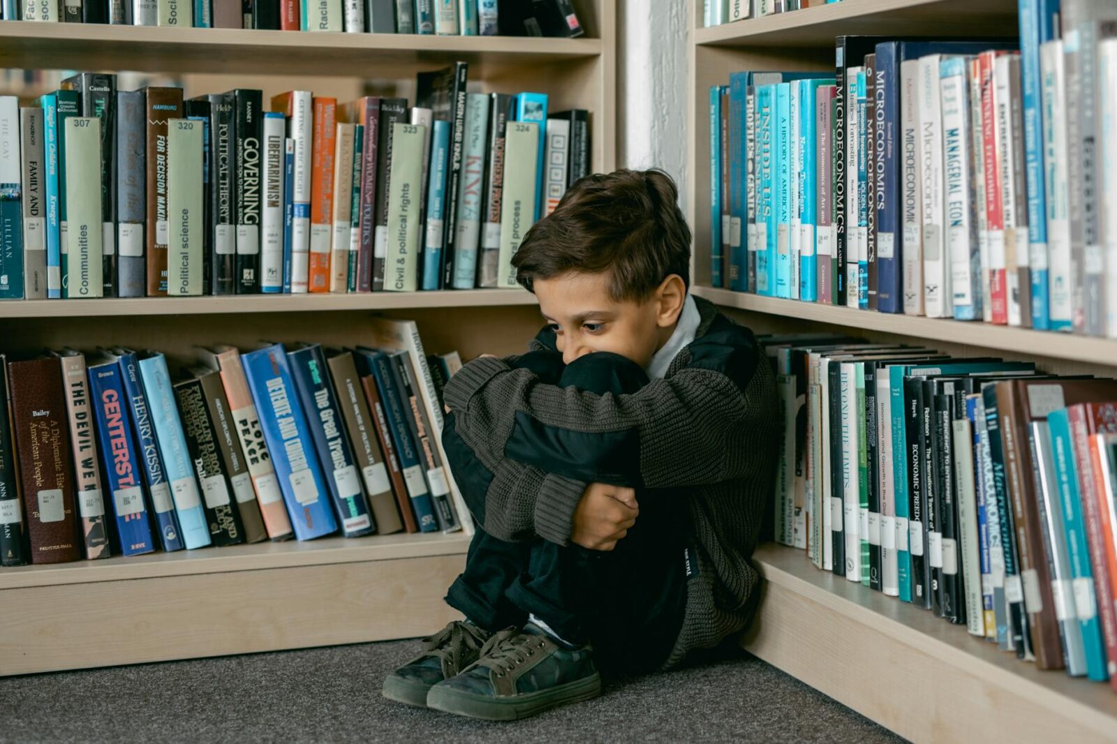 12 Essential Life Skills to Teach Your Kids (Beyond School Lessons) 18 boy sitting in a library 12 Essential Life Skills to Teach Your Kids (Beyond School Lessons)