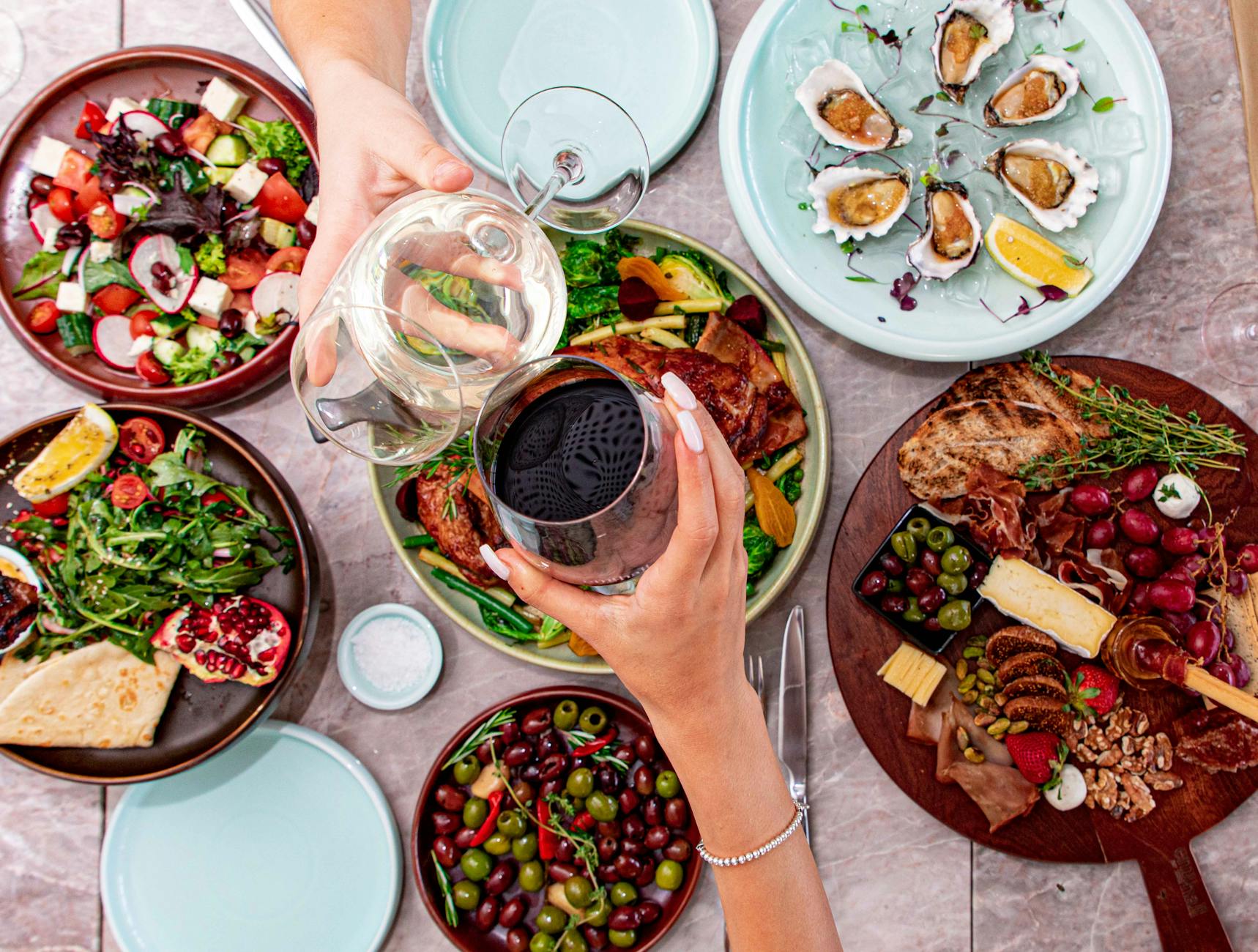 Elevate Your Escape: Plan a Luxury Travel Experience 10 a person holding a glass of red wine Elevate Your Escape: Plan a Luxury Travel Experience
