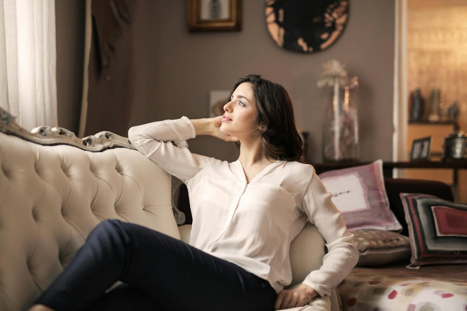 woman in white dress shirt and black pants Your Ultimate Guide to Buying a Luxury Home