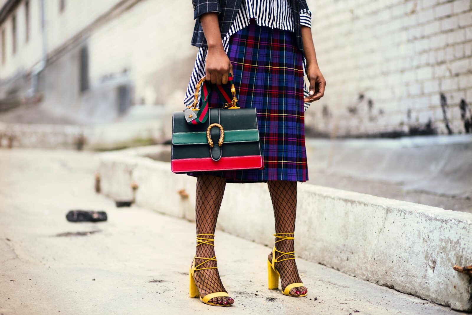 woman holding leather handbag